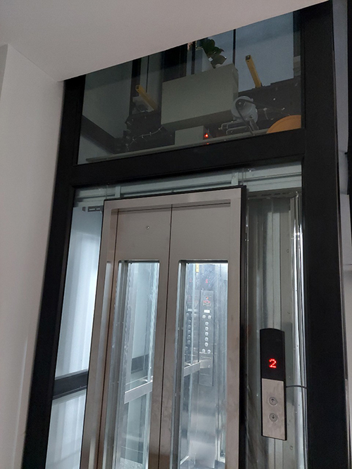 Thang máy Cabin kính xen kẽ inox