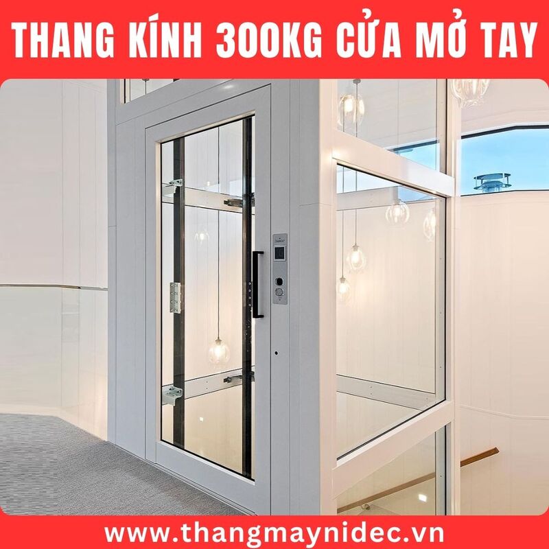 Thang máy kính 300kg cửa mở tay
